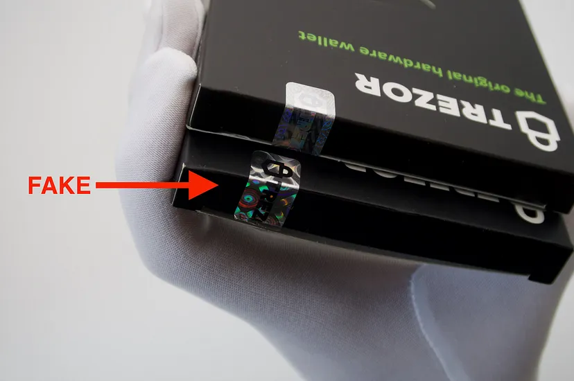 Original holographic seal on Trezor One (top) vs. counterfeit version (bottom). Source: blog.trezor.io/ - The Coinomist