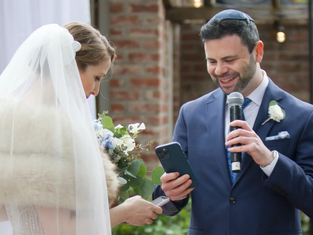 Rebecca Rose and Peter Kacherginsky exchanging NFTs during their marriage ceremony – The Coinomist