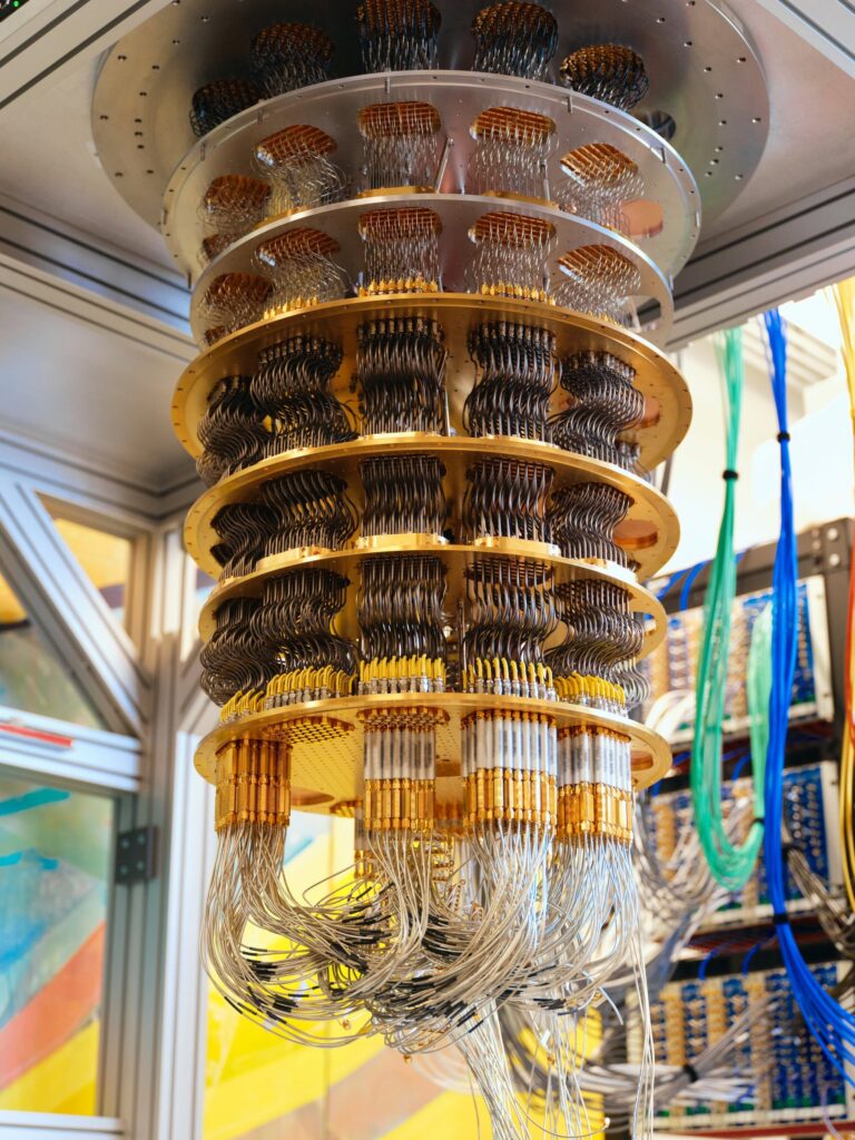 Google’s quantum computer, showcasing its complex wiring and superconducting structure – The Coinomist.