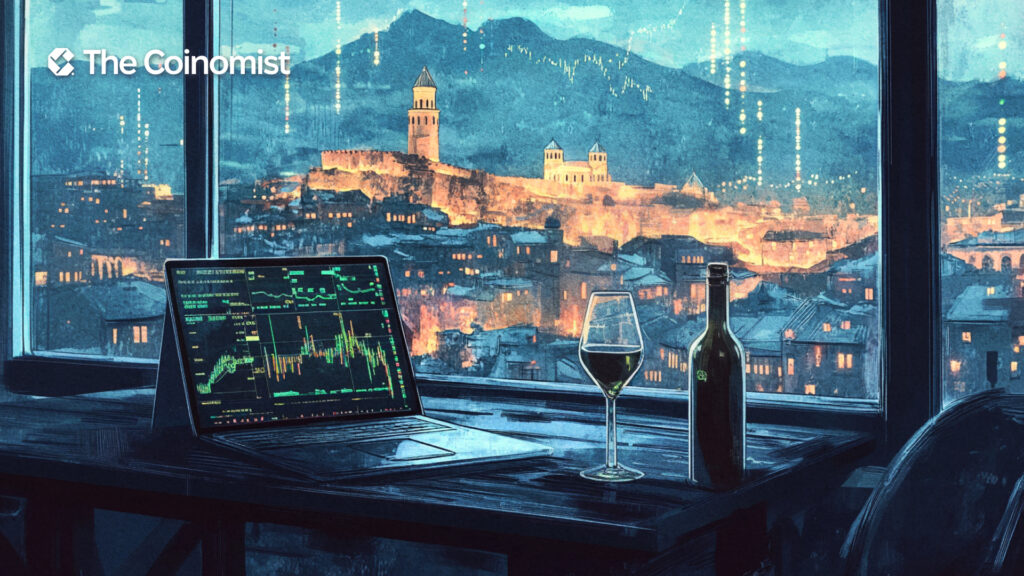 On the table there is a bottle of wine, a plate of khinkali and a laptop with stock charts on the screen - The Coinomist