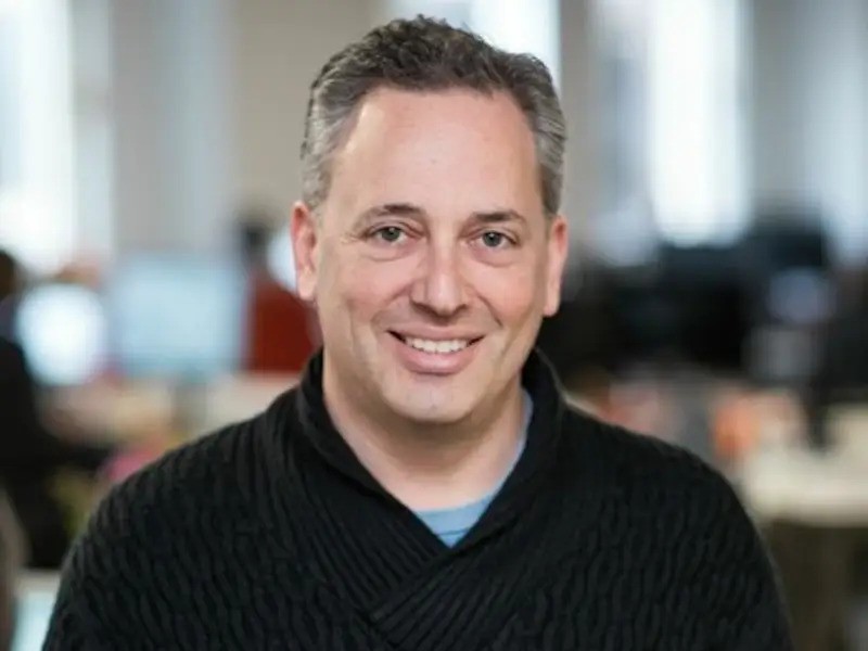 White House AI and crypto advisor David Sacks smiling in front of a blurred background - The Coinomist