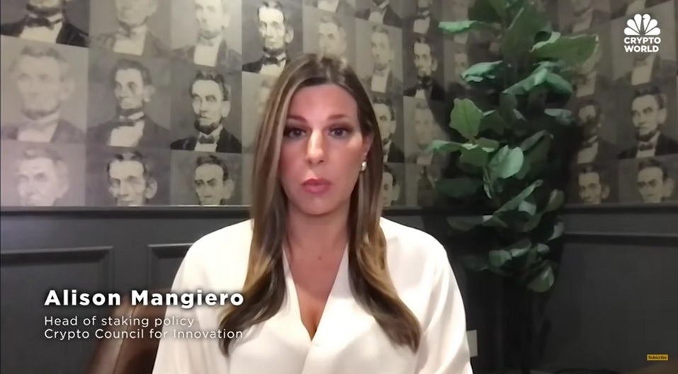 Alison Mangiero on-screen in a white blouse, seated against a wallpaper of Abraham Lincoln portraits, discussing crypto staking regulation — The Coinomist
