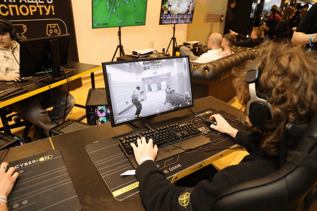 Attendee in action during CS2 match — The Coinomist.