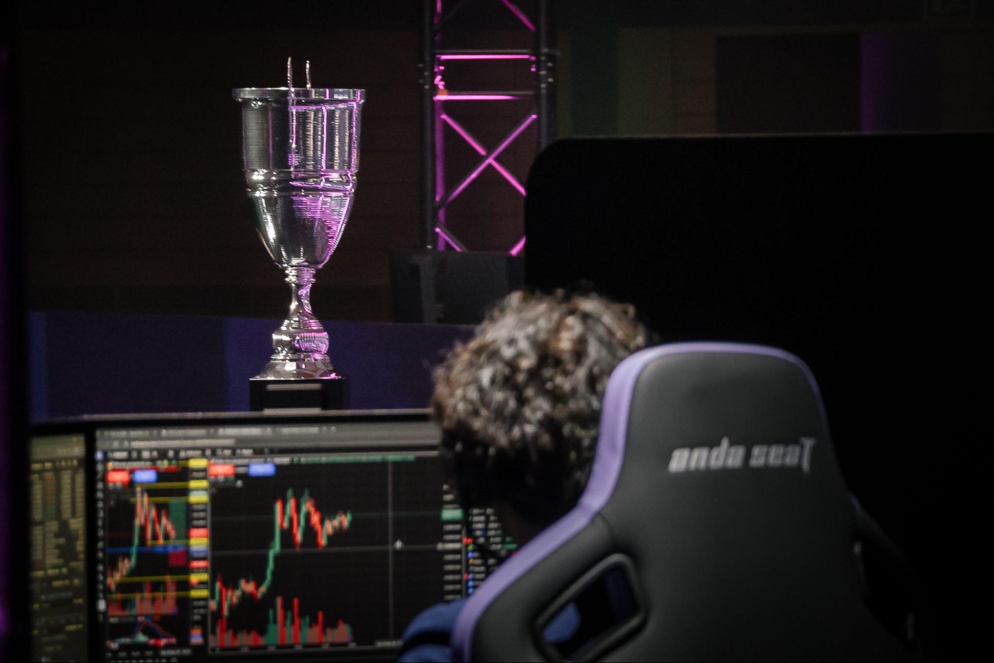 A trader studies real-time market charts - The Coinomist